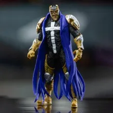 Full view of the Spawn Disruptor action figure in black, gold, and a flowing blue cape.