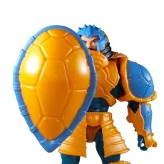 Man-At-Arms action figure holding the large, turtle shell shield in front of his body.