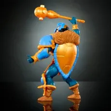 Side view of the Man-At-Arms action figure holding a mace, showing the large turtle shell shield on his back.