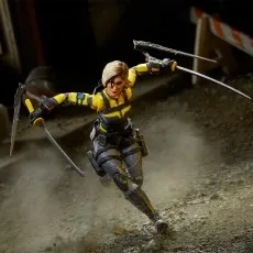 Agent Helix figure running, dual-wielding katanas, kicking up dust in an action pose.