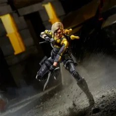 G.I. Joe Agent Helix action figure in yellow and gray suit charging forward with swords.