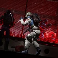 Action figure of Airborne in his helmet, attacking an enemy with a knife in a dark, gritty diorama.