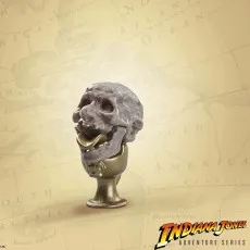 Build An Artifact piece A gruesome gray skull with a gold chalice base, on a world map background.