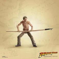 Hypnotized Indiana Jones action figure, shirtless, with a spear held horizontally, on a map background.