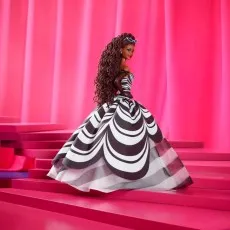 Turtles of Grayskull Ram Man figure, loose with two axes and the packaged toy to the left.