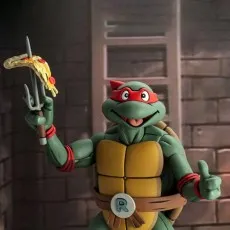 Barbie Signature 65th Anniversary doll in a black and white gown, posed on pink steps in front of pink curtains.