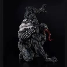 Detailed side profile of the Venom figure in a low, crawling attack pose with tongue fully extended.