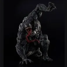 Full Venom action figure in a crouched, snarling pose with his long tongue hanging out on a black background.