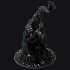 Marvel Venom figure on a round base, with his tongue out and white spider symbol visible.