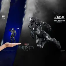 Threezero DLX War Machine Mark II figure shown in a dynamic pose and in a hand for scale (17.5 cm).