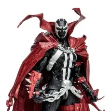 Close-up of the Spawn action figure in his black and white suit, a flowing red cape, and silver chains.