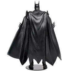 Rear view of the Batman action figure on a black stand, highlighting the sculpt of his black flowing cape.