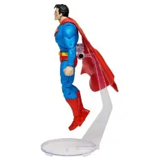 Side view of a Superman action figure flying, next to its boxed version displaying articulation points.