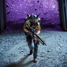 G.I. Joe Tunnel Rat figure advancing in a tunnel under purple lighting, carrying a large weapon and backpack.