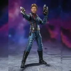 A Star-Lord action figure in a blue and red suit holds two blasters, ready for action.