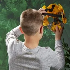 Collage showing a girl transforming a yellow Bumblebee toy from a spherical object into its full robot mode.