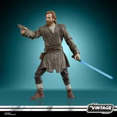 Vintage Collection Obi-Wan Kenobi figure holding a blaster and a blue lightsaber, posed dynamically.