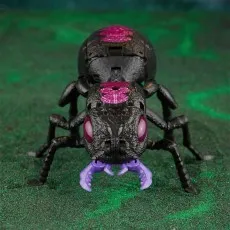 Transformers Antagony in black ant mode, facing forward with purple mandibles and eyes.