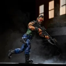 G.I. Joe Dreadnok Ripper figure running through smoke, wearing red goggles and holding an assault rifle.