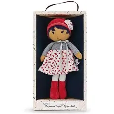 Kaloo My First Doll wearing a red beret and heart-print skirt, sealed inside its windowed box.