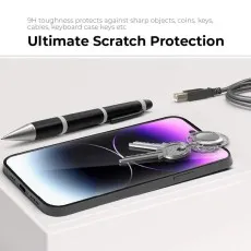 Keys, pen, and cable resting on a phone, showing ultimate scratch protection..