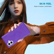 Close-up of a man holding the pruple leather phone case with the camera cutout.