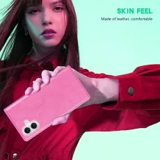 Close-up of a man holding the pink leather phone case with the camera cutout.