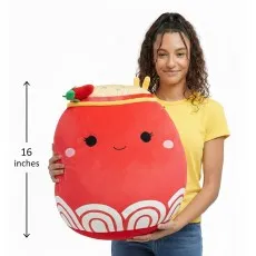 Woman holding a large, 16-inch red ramen Squishmallow plush for size reference.