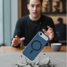 Man reacting as the blue MagSafe phone case bounces off a cracked floor..