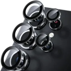 Five individual black metallic ring camera lens protectors being applied to a smartphone
