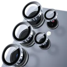 Five Clear ring camera lens protectors being applied to a light blue smartphone.